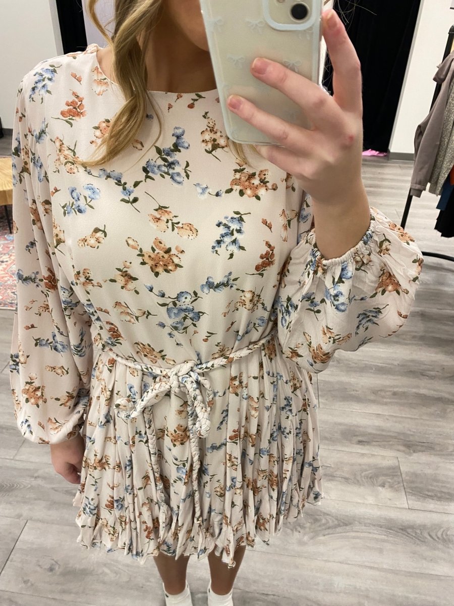 Close up of floral print fabric on long sleeve mini dress — Three:Twelve Boutique