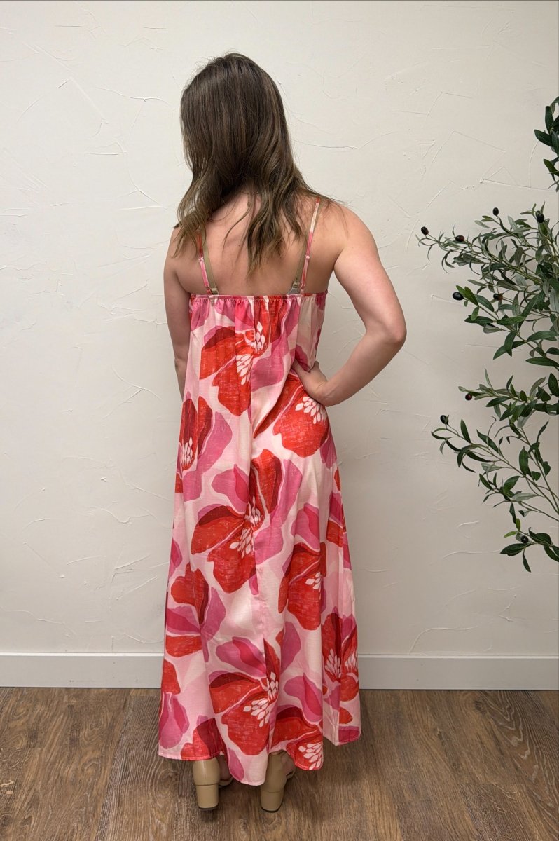 Back view of Floral Print Strap Linen Maxi Dress on model highlighting strap design and flow — Three Boutique