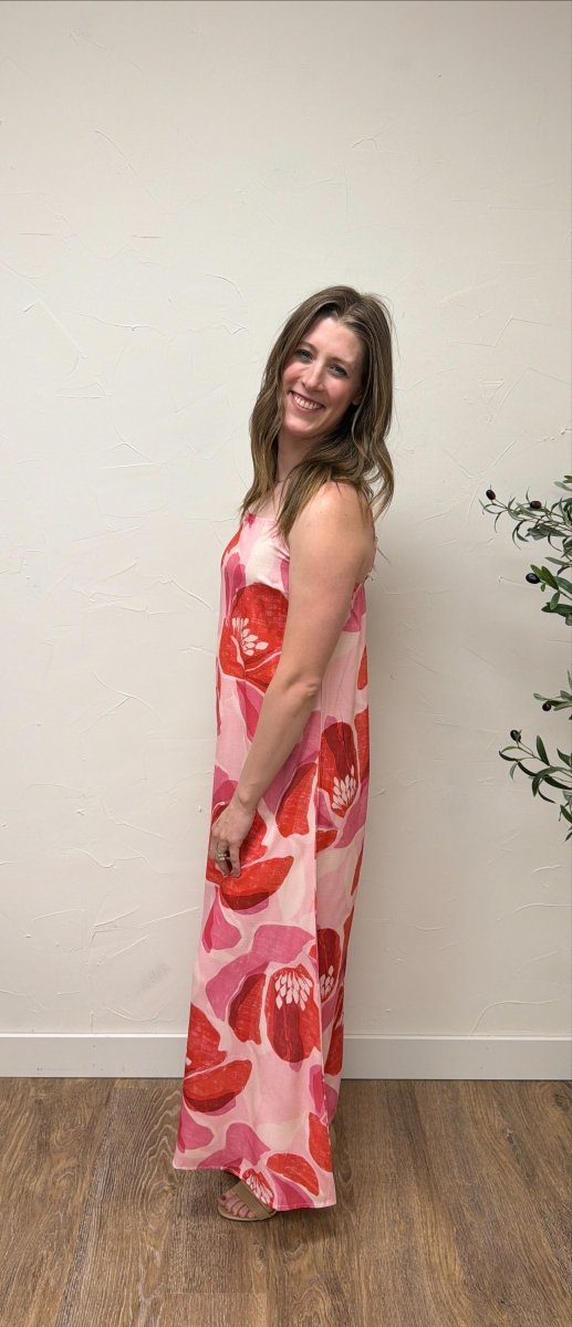 Side view of model wearing Floral Print Strap Linen Maxi Dress showing flowing maxi length — Three Boutique