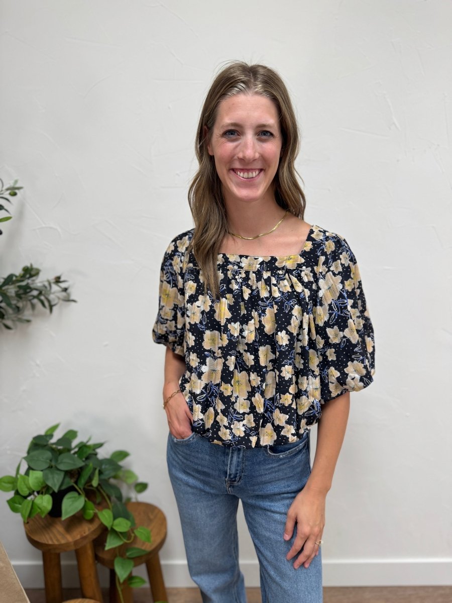 Front view of floral print square neck balloon hem blouse on model — Three:Twelve Boutique