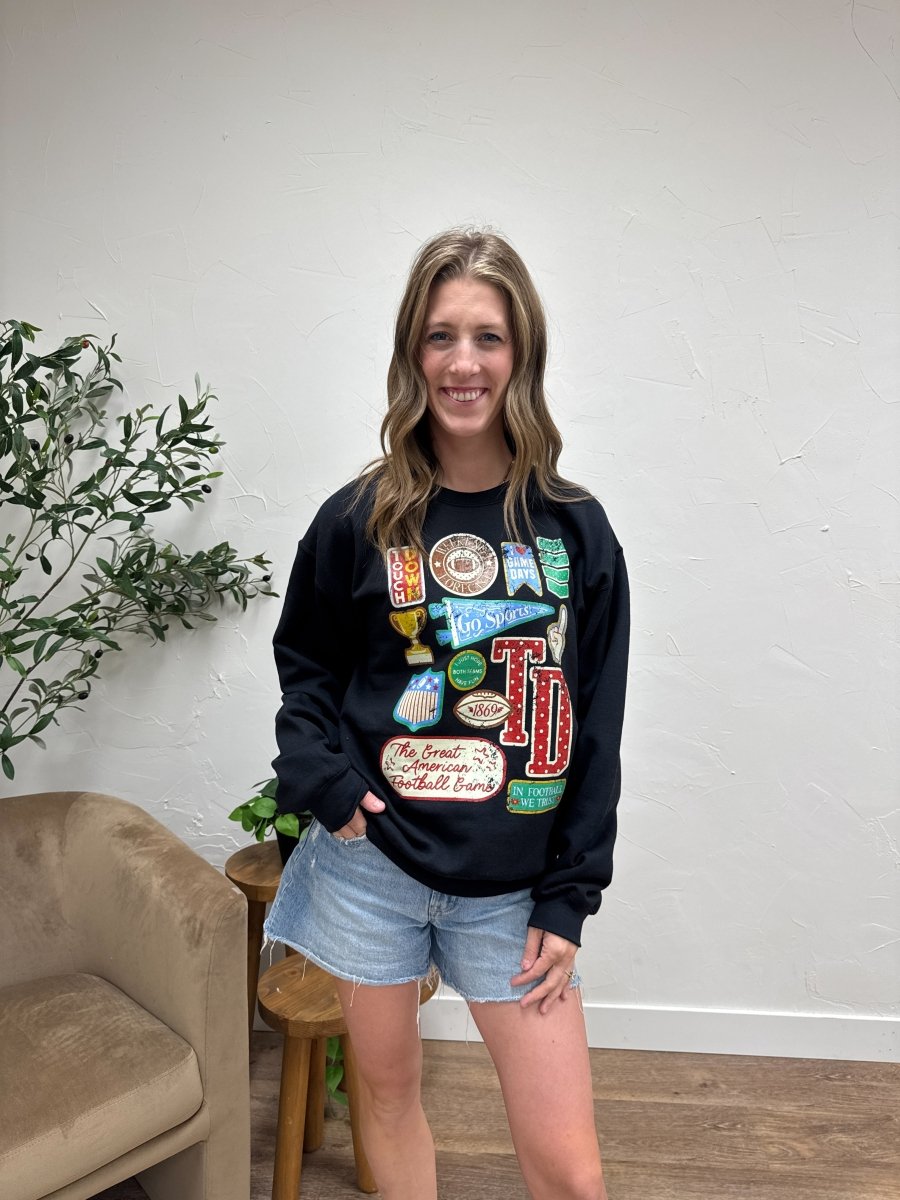 Front view of model wearing Football Varsity Patch sweatshirt with graphic varsity detail — Three:Twelve Boutique