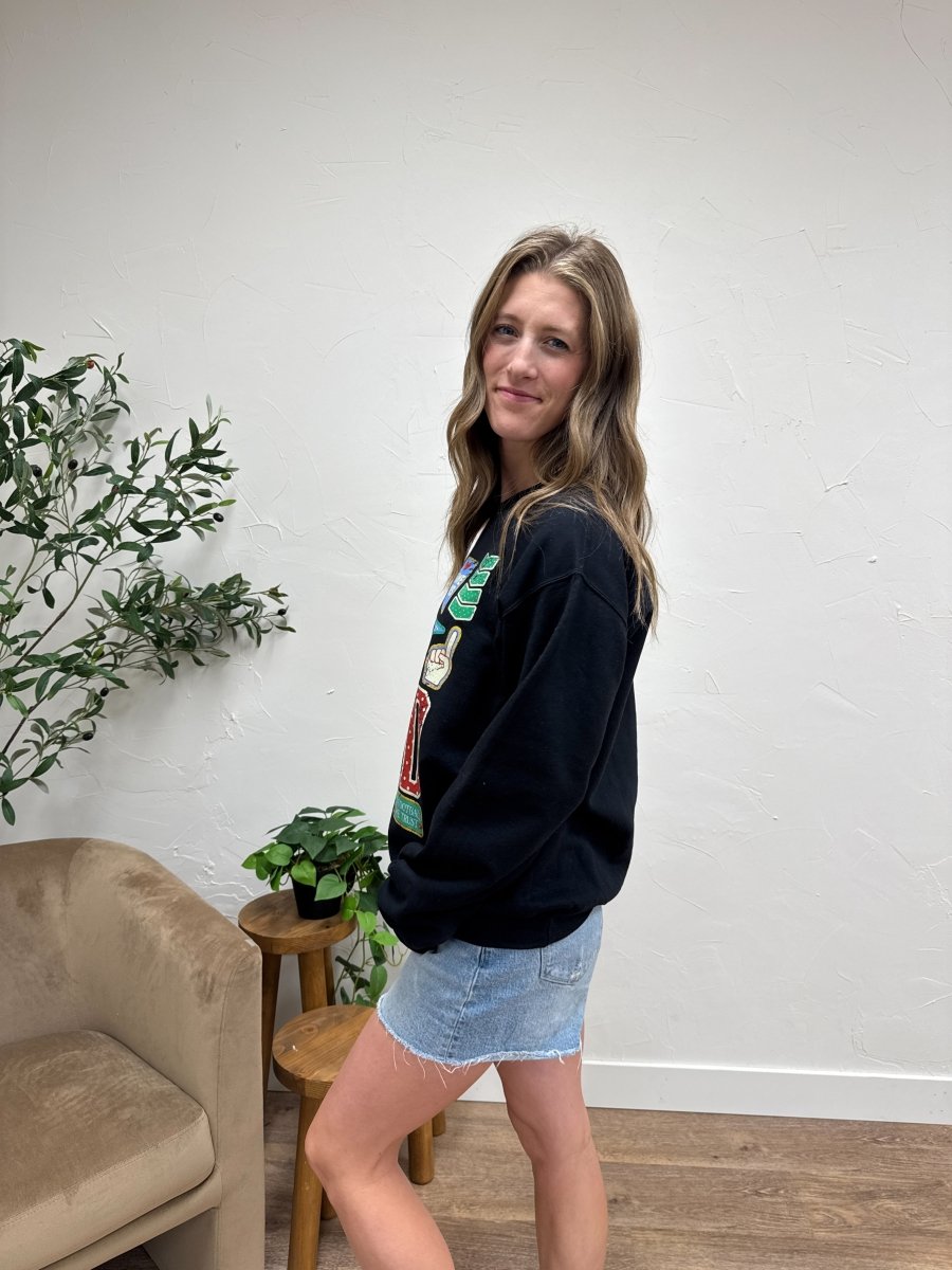 Side view of Football Varsity Patch sweatshirt showing relaxed fit and sleeve detail — Three:Twelve Boutique