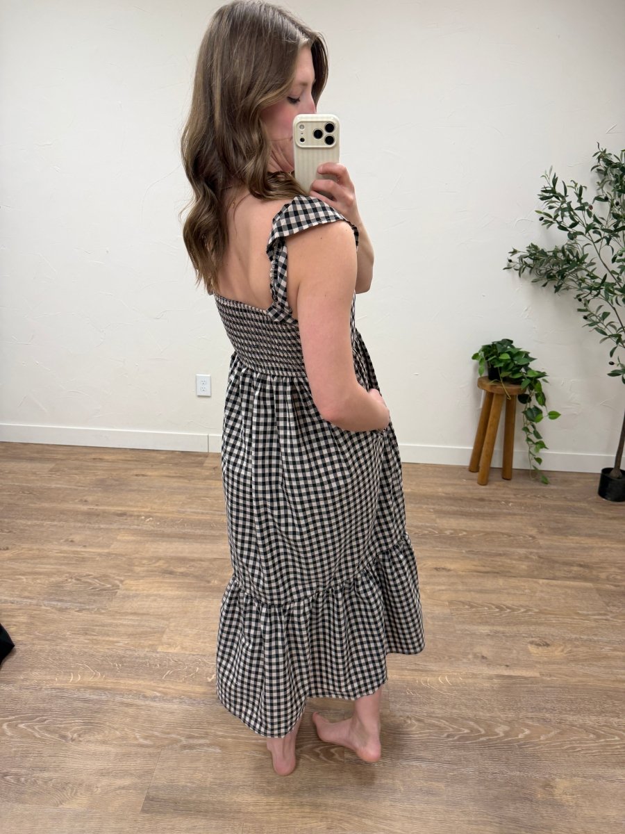 Back view of gingham flutter sleeve maxi dress showing full length and silhouette — Three:Twelve Boutique