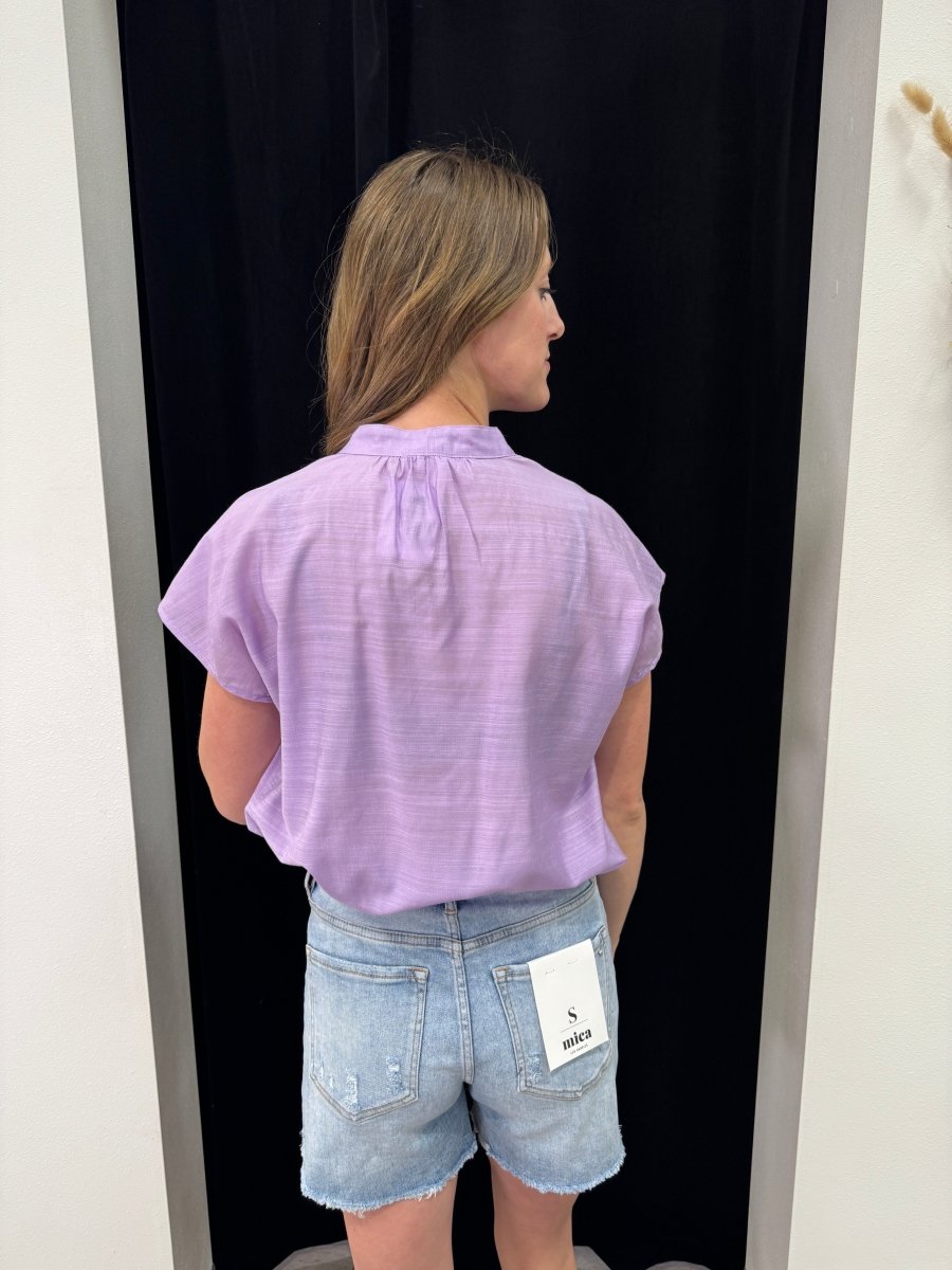 Back view of model wearing Henley button down top showing relaxed fit — Three:Twelve Boutique