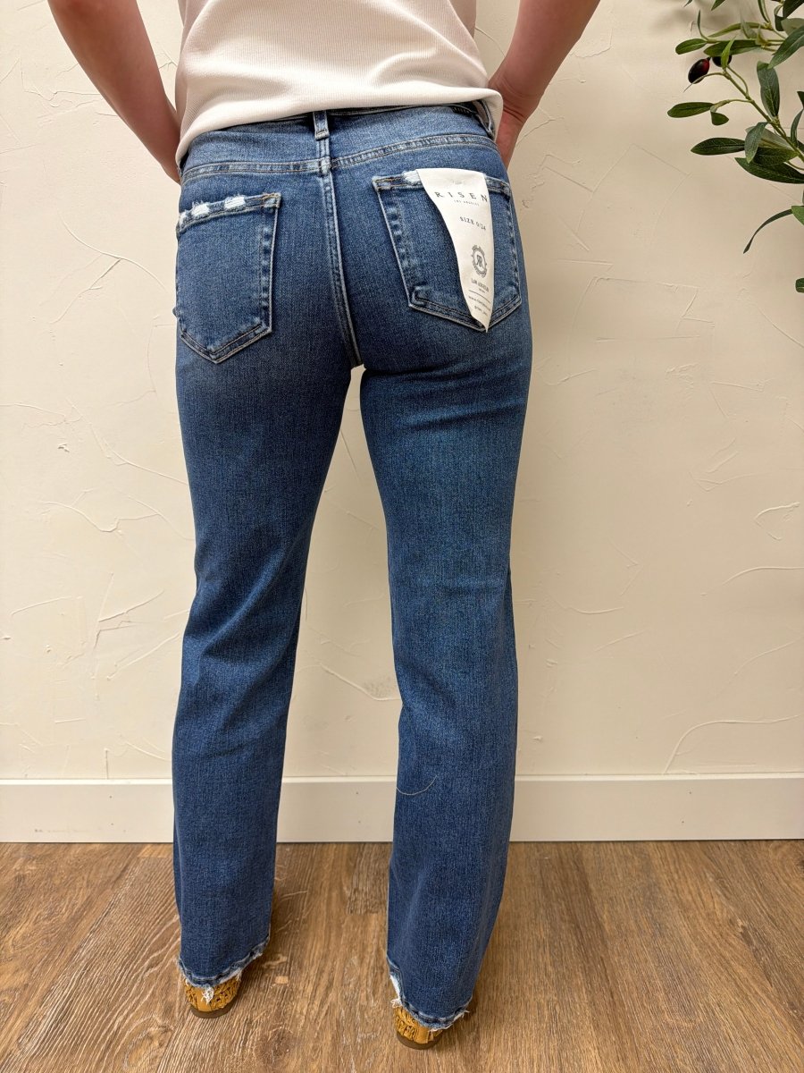 Back view of jeans highlighting distressed pockets and straight cut — Three:Twelve Boutique