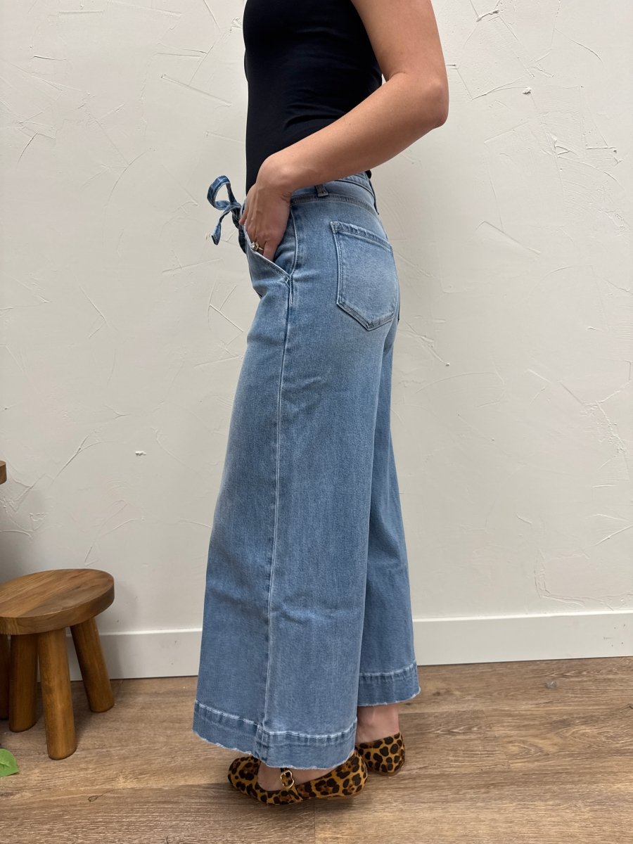Side view of high rise palazzo pants showing flowy wide leg fit — Three:Twelve Boutique