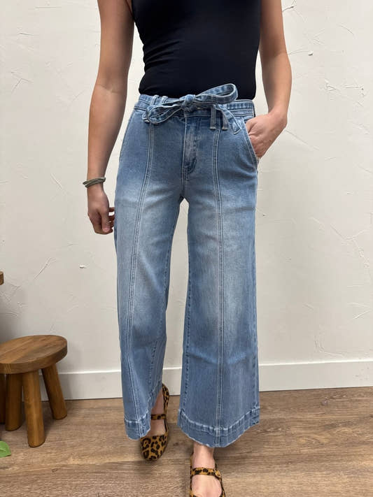 Front view of high rise crop palazzo pants with tie waist on model — Three:Twelve Boutique