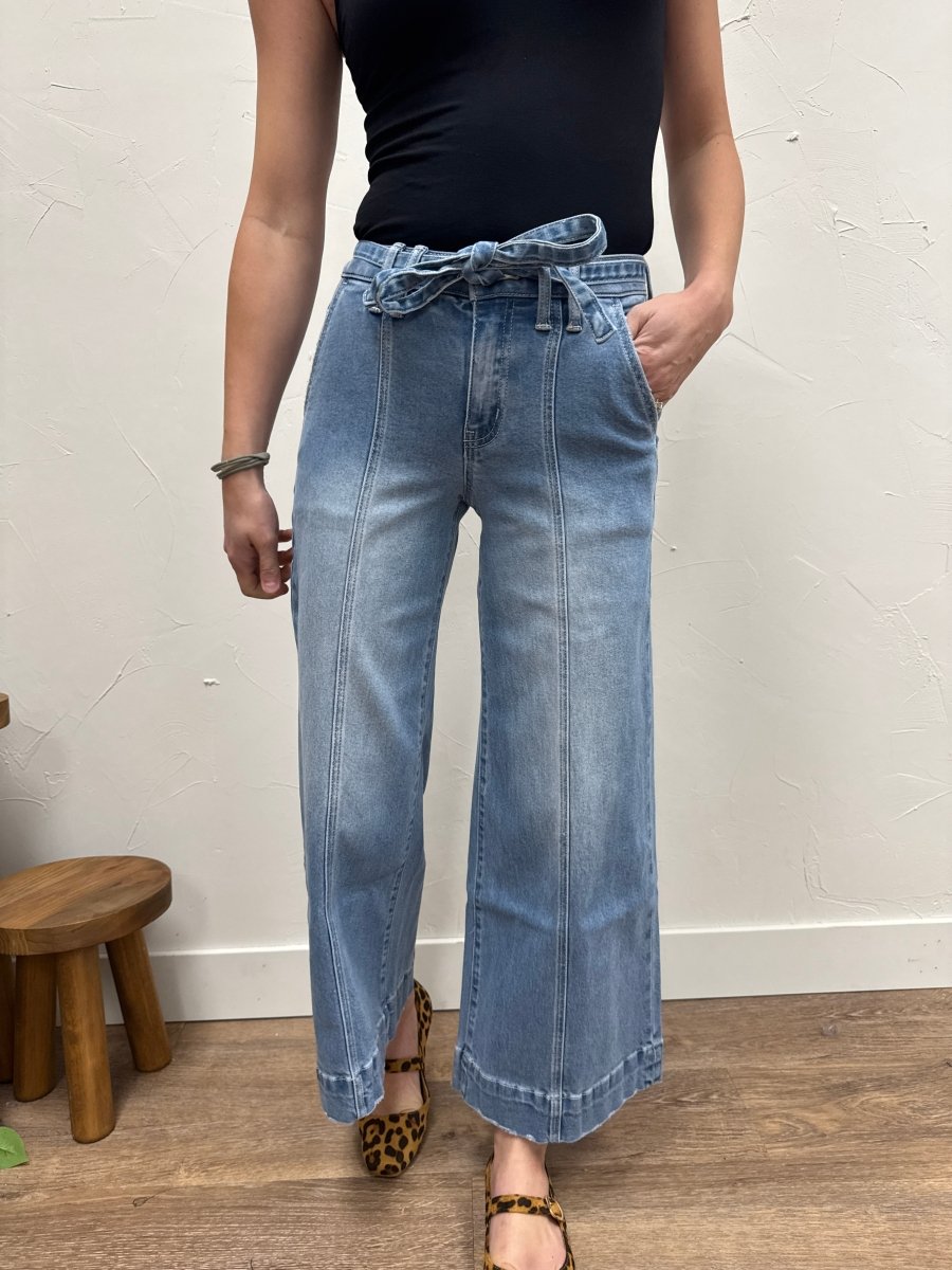 Front view of high rise crop palazzo pants with tie waist on model — Three:Twelve Boutique