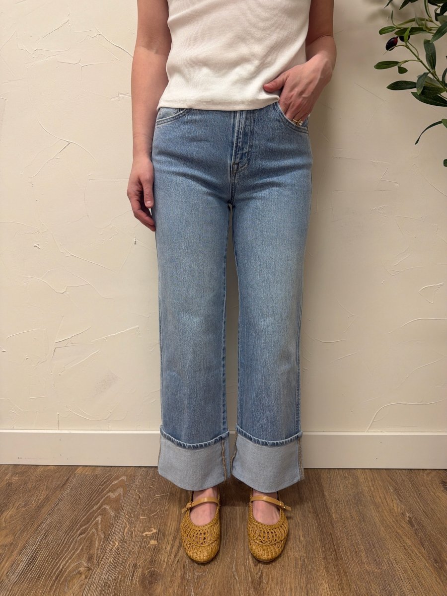 Lifestyle shot of model styling baggy straight Vervet denim with casual outfit — Three:Twelve Boutique