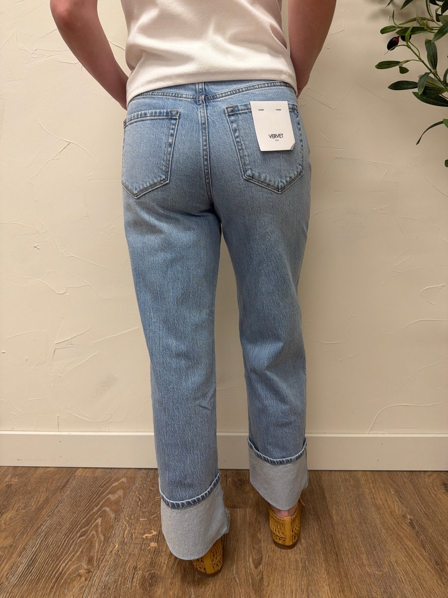 Back view of model wearing Vervet denim jeans showing relaxed fit and pocket detail — Three:Twelve Boutique