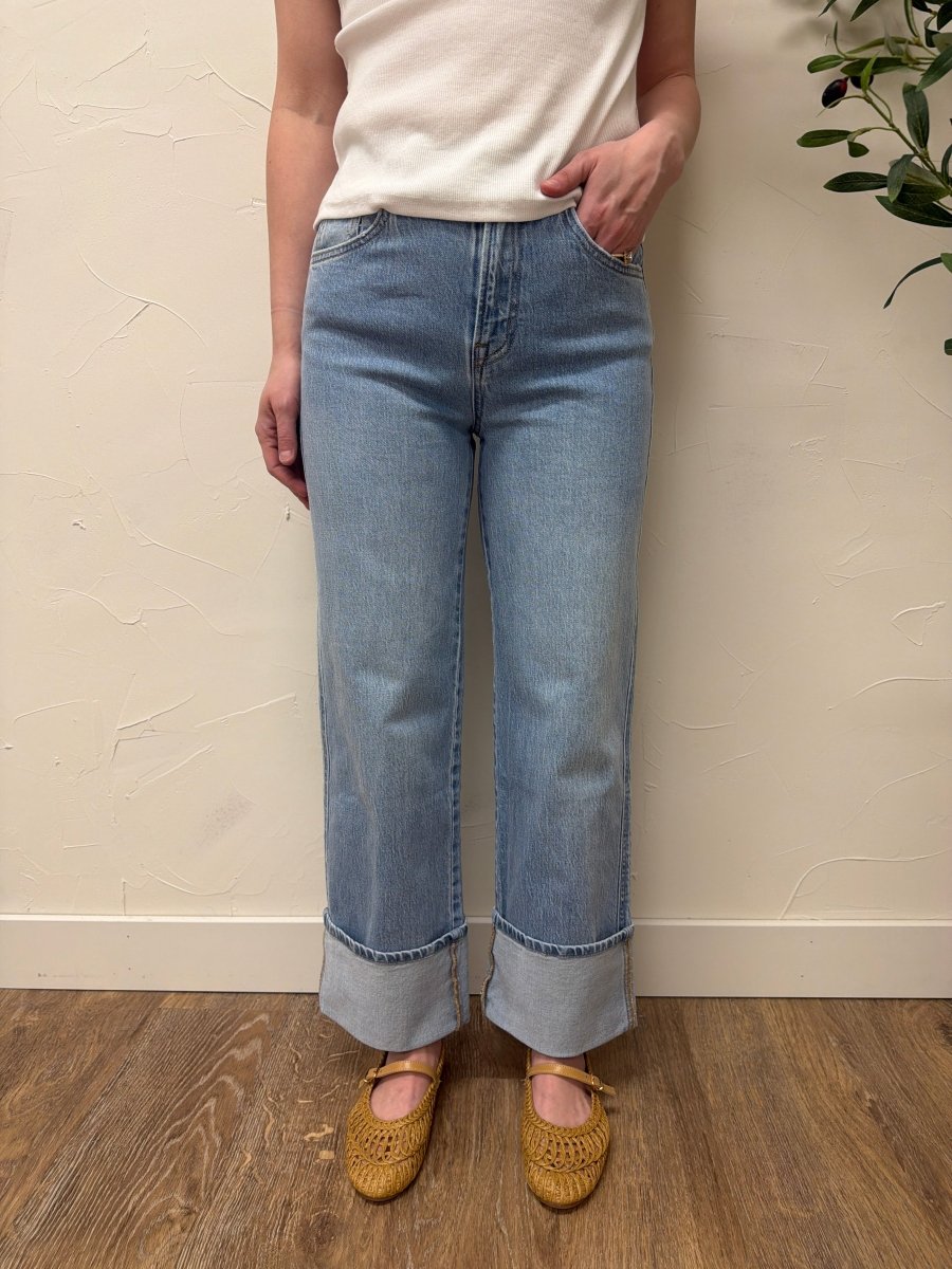 Lifestyle shot of model styling baggy straight Vervet denim with casual outfit — Three:Twelve Boutique