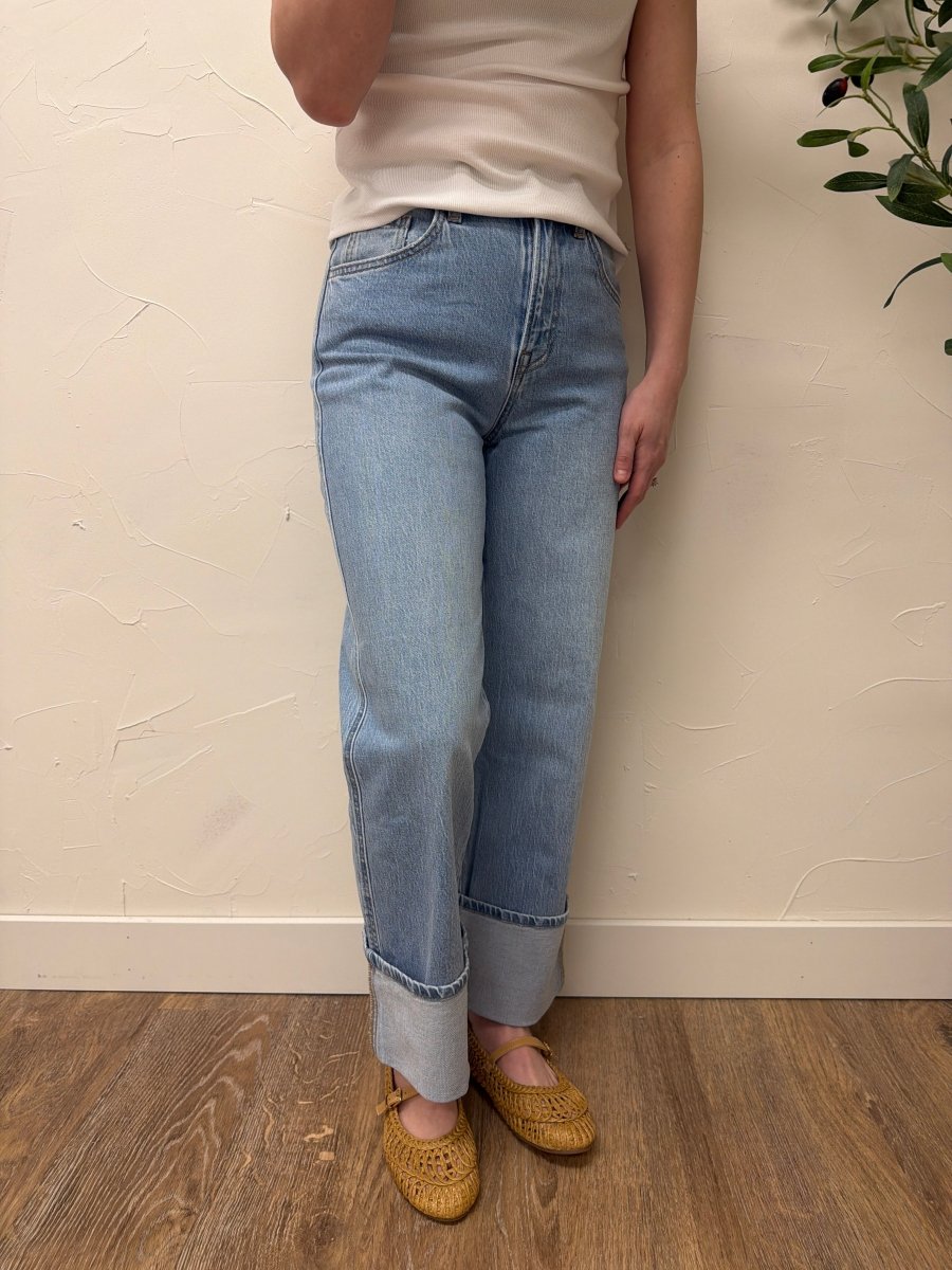 Lifestyle shot of model styling baggy straight Vervet denim with casual outfit — Three:Twelve Boutique