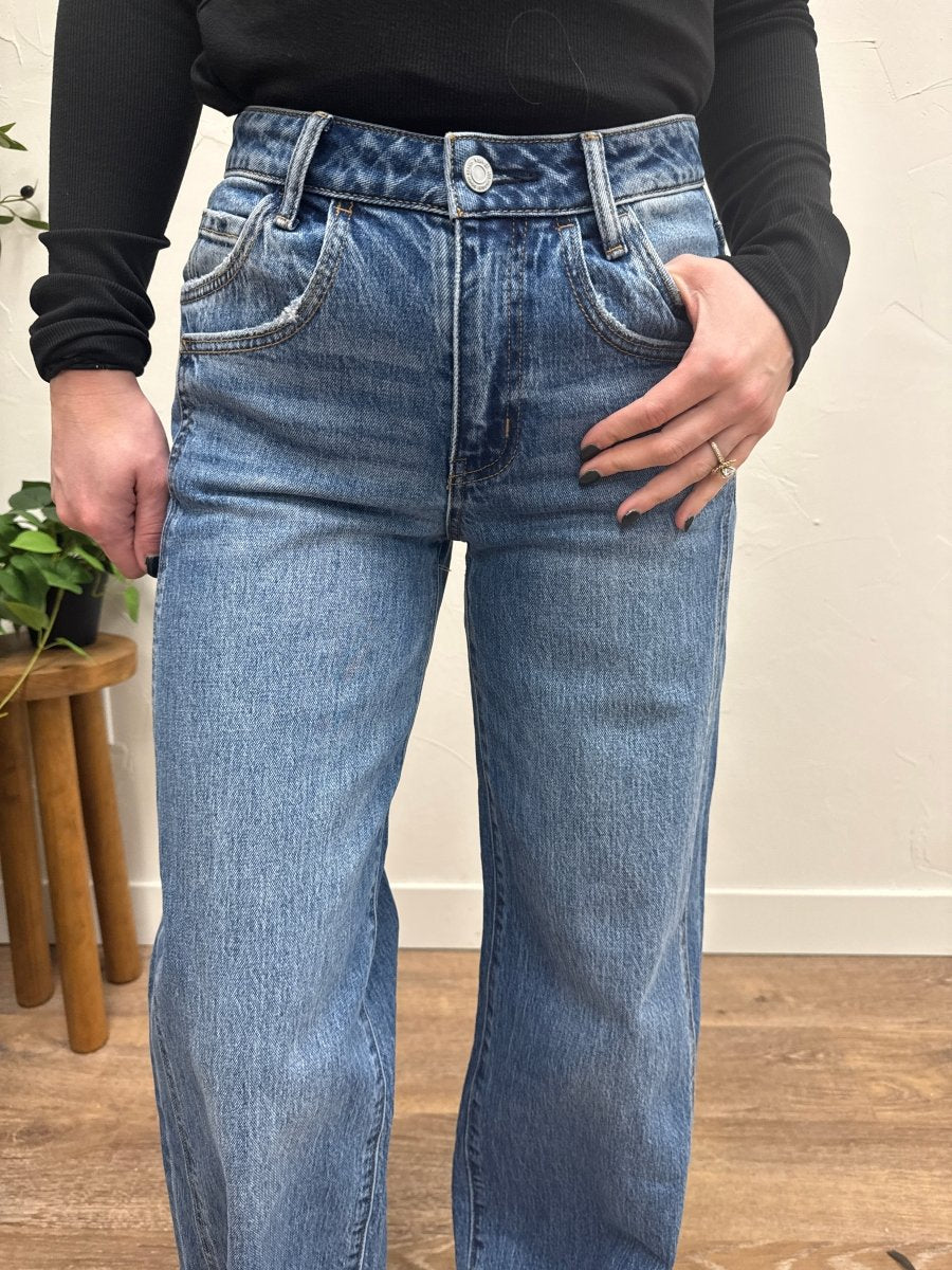 Close up of denim fabric and panel stitching detail on jeans — Three:Twelve Boutique