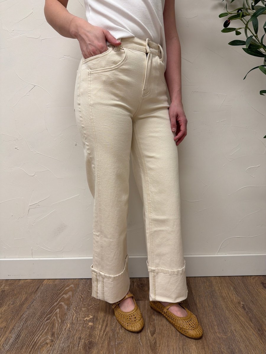 Lifestyle shot of model wearing High Rise Cuffed Wide Leg Vervet Denim jeans paired with casual top — Three:Twelve Boutique
