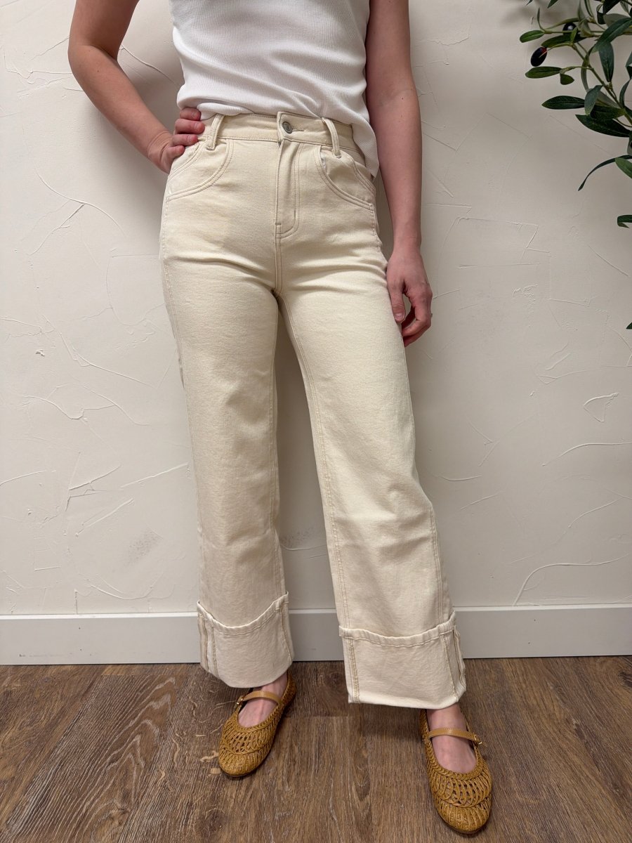 Lifestyle shot of model wearing High Rise Cuffed Wide Leg Vervet Denim jeans paired with casual top — Three:Twelve Boutique