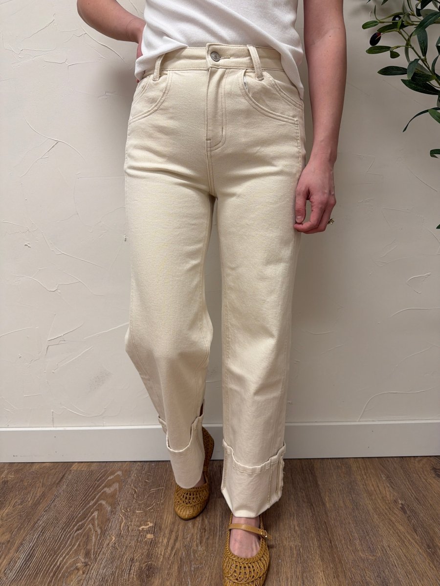 Lifestyle shot of model wearing High Rise Cuffed Wide Leg Vervet Denim jeans paired with casual top — Three:Twelve Boutique