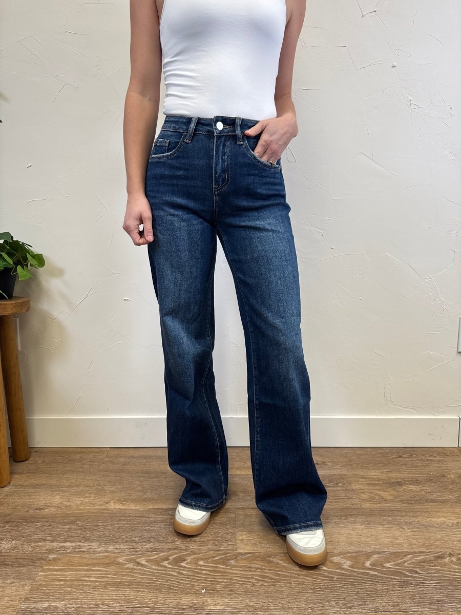Close up of denim texture and dark wash finish on wide leg jeans — Three:Twelve Boutique