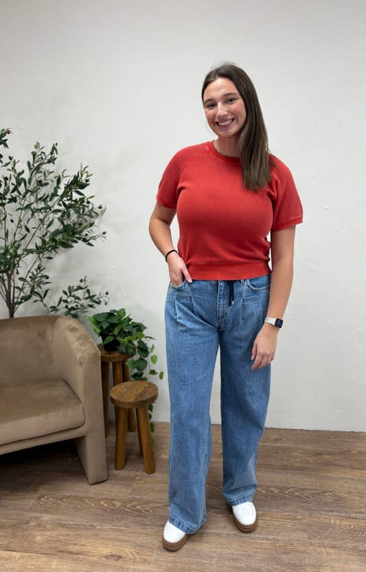 Lifestyle shot of model styling wide leg jeans in casual outfit — Three:Twelve Boutique