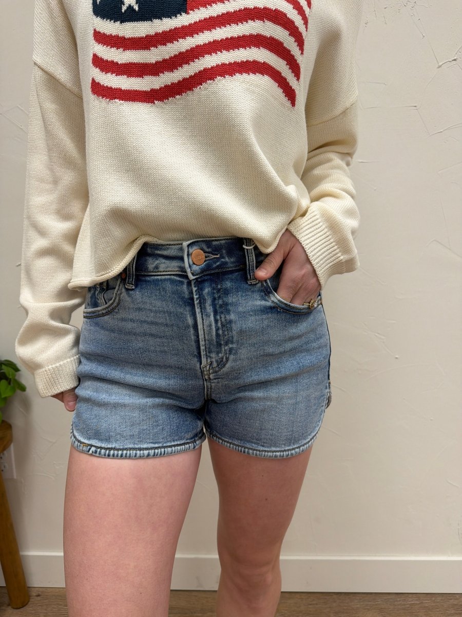 Front view of high rise denim shorts by Risen Denim showing round hem design — Three:Twelve Boutique