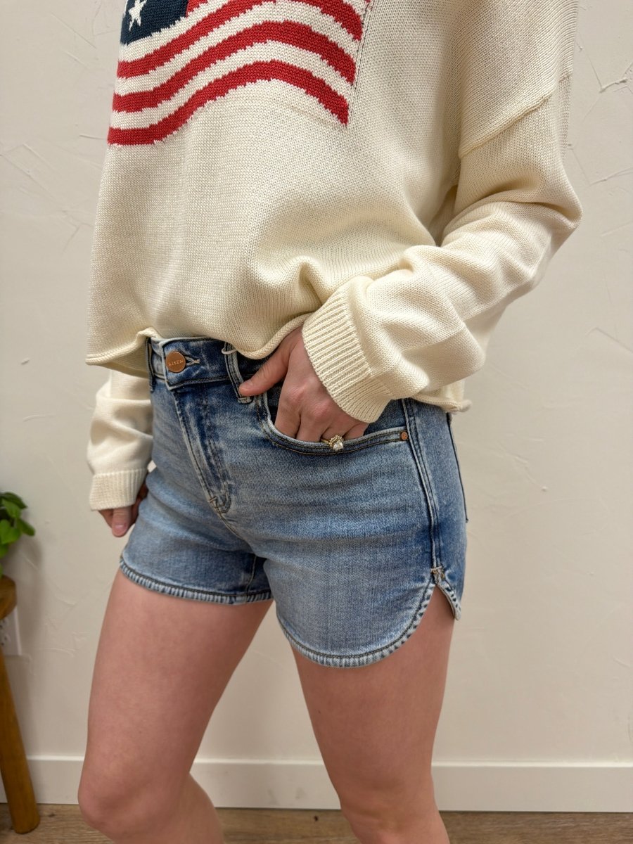 Close up of denim fabric and stitching detail on shorts — Three:Twelve Boutique