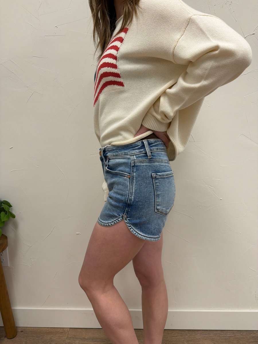 Side view of denim shorts showing high waist fit and rounded hem — Three:Twelve Boutique