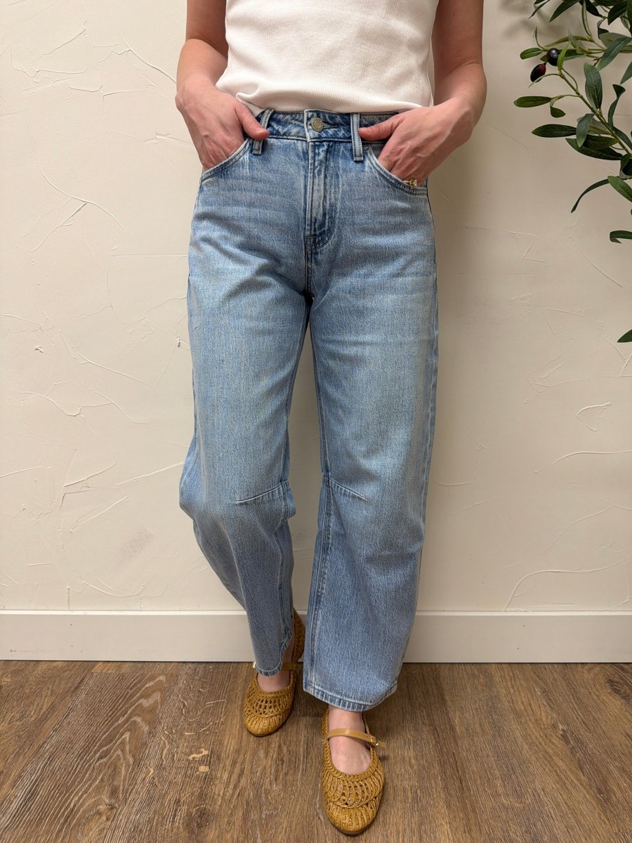 Lifestyle shot of model wearing Vervet denim styled with casual top and sneakers — Three:Twelve Boutique