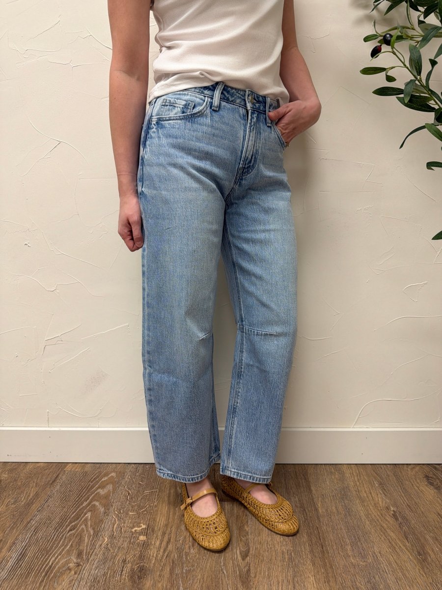 Side view of high rise wide barrel jeans showing wide leg drape — Three:Twelve Boutique