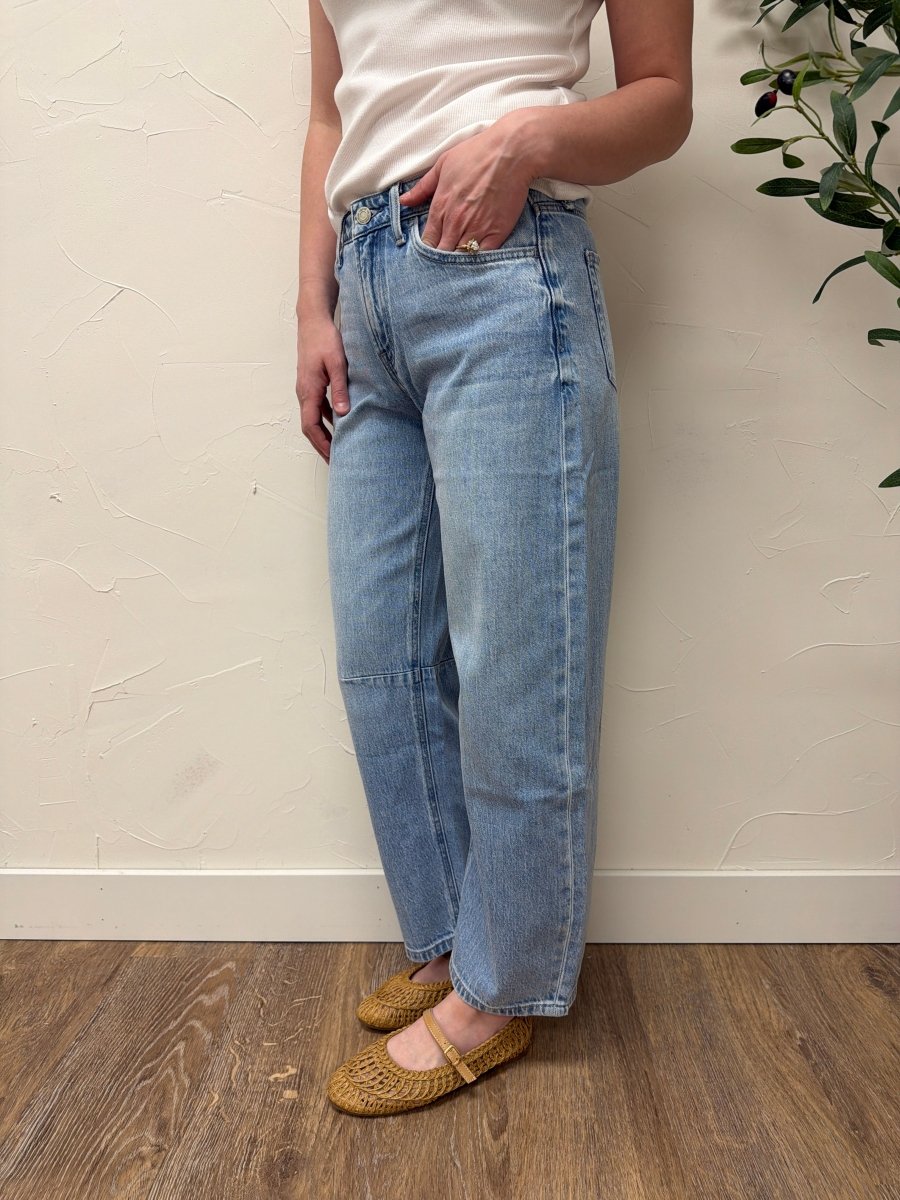 Side view of high rise wide barrel jeans showing wide leg drape — Three:Twelve Boutique
