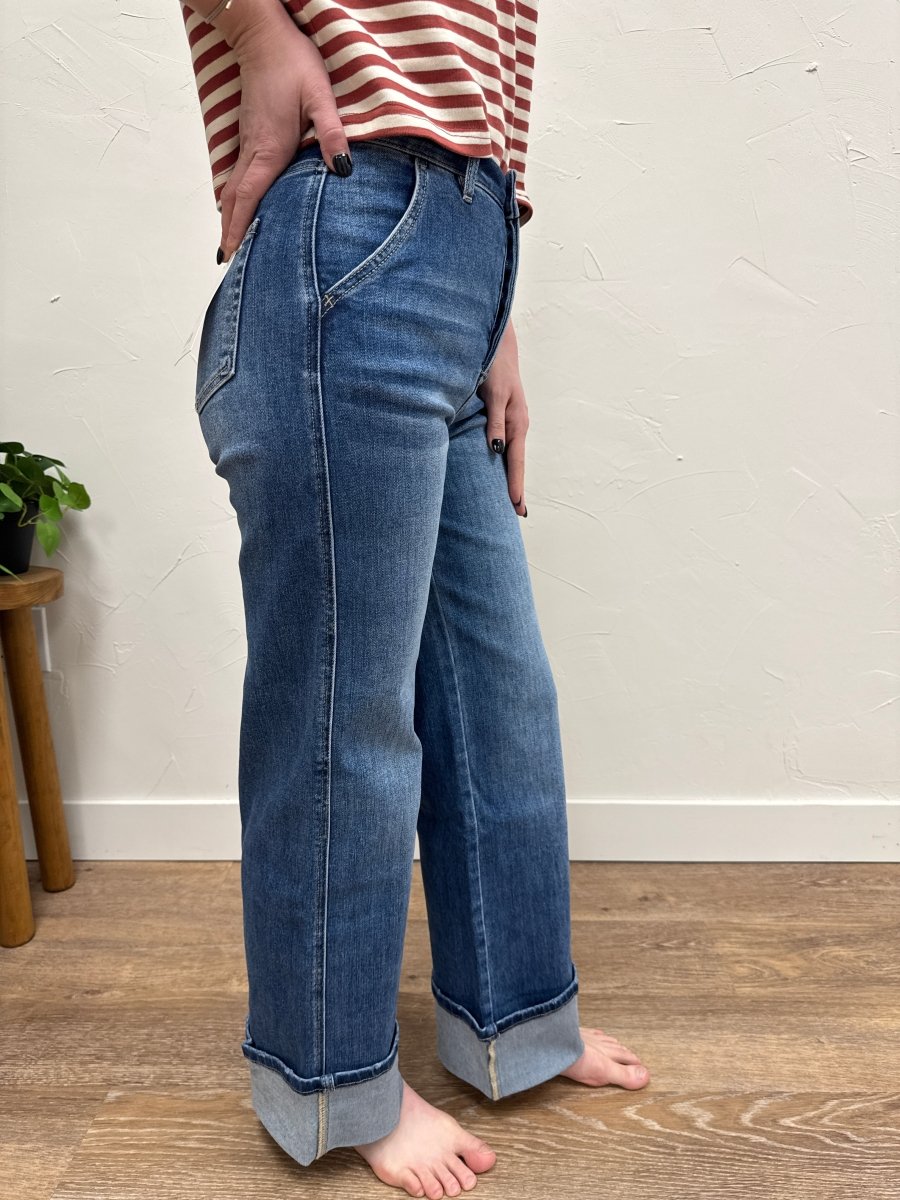 Side view of high rise wide leg jeans showing silhouette and cuffed bottom — Three:Twelve Boutique
