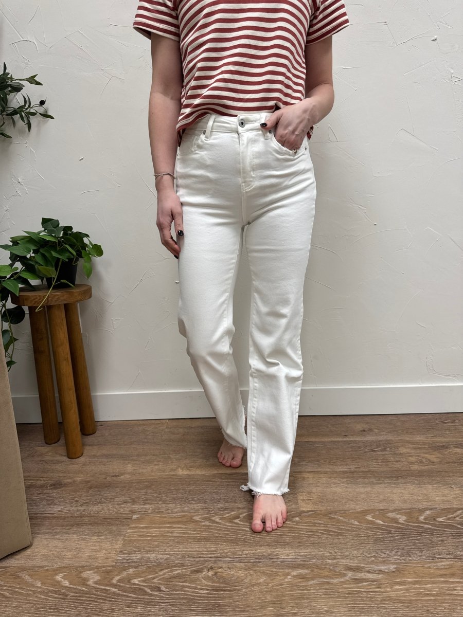 Front view of model wearing high rise wide leg jeans with raw hem — Three:Twelve Boutique