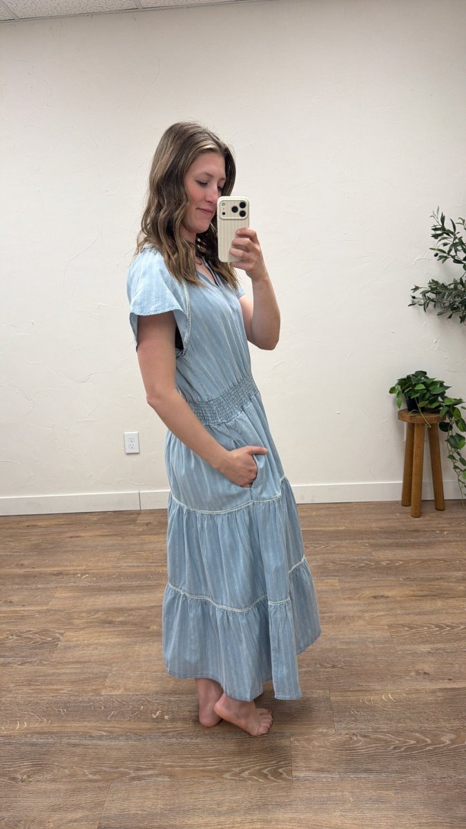 Side view of Junia Dress on model showing flowy drape — Three:Twelve Boutique