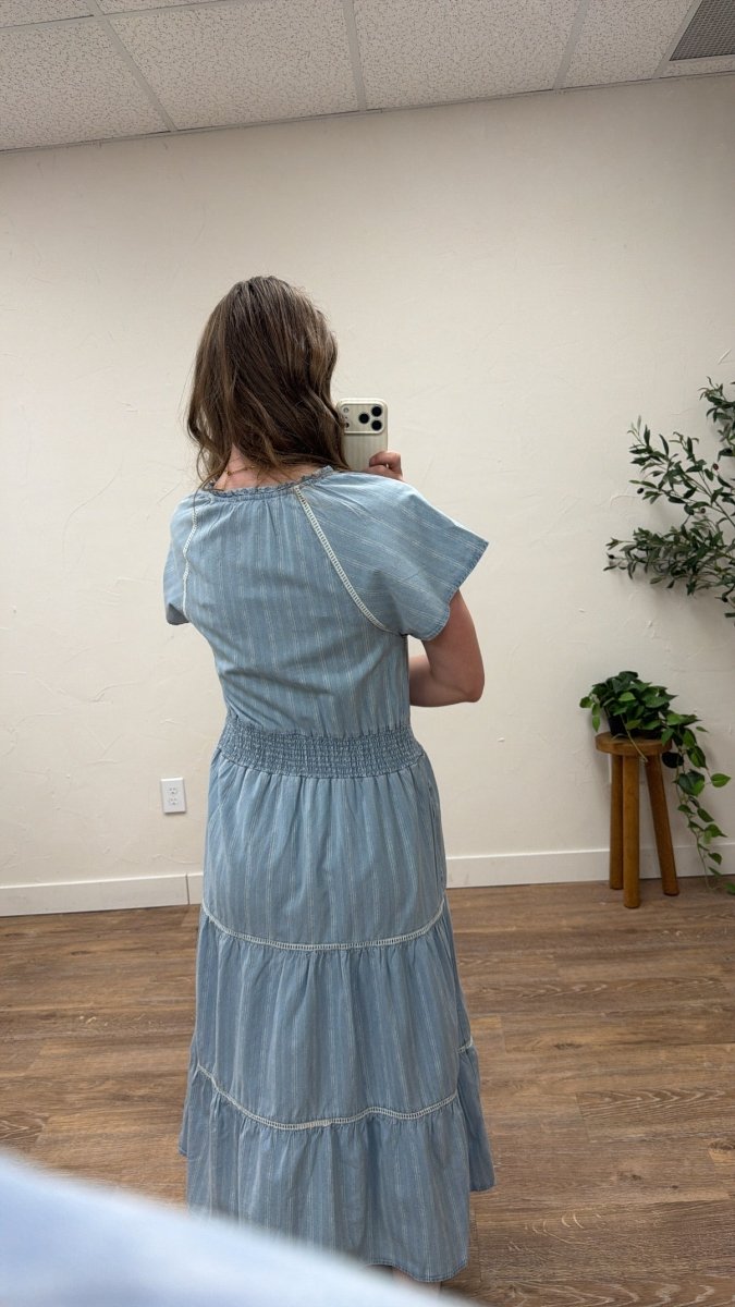 Back view of model wearing Junia Dress highlighting loose shape — Three:Twelve Boutique