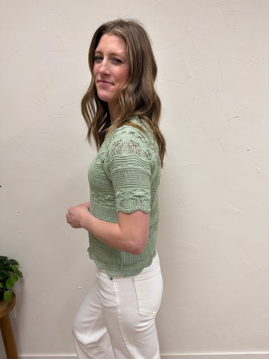 Side view of knit short sleeve top showing sleeve length and drape — Three:Twelve Boutique