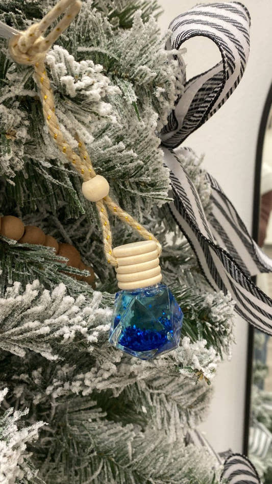 Front view of Lava car diffuser bottle with wooden cap and hanging cord — Three:Twelve Boutique