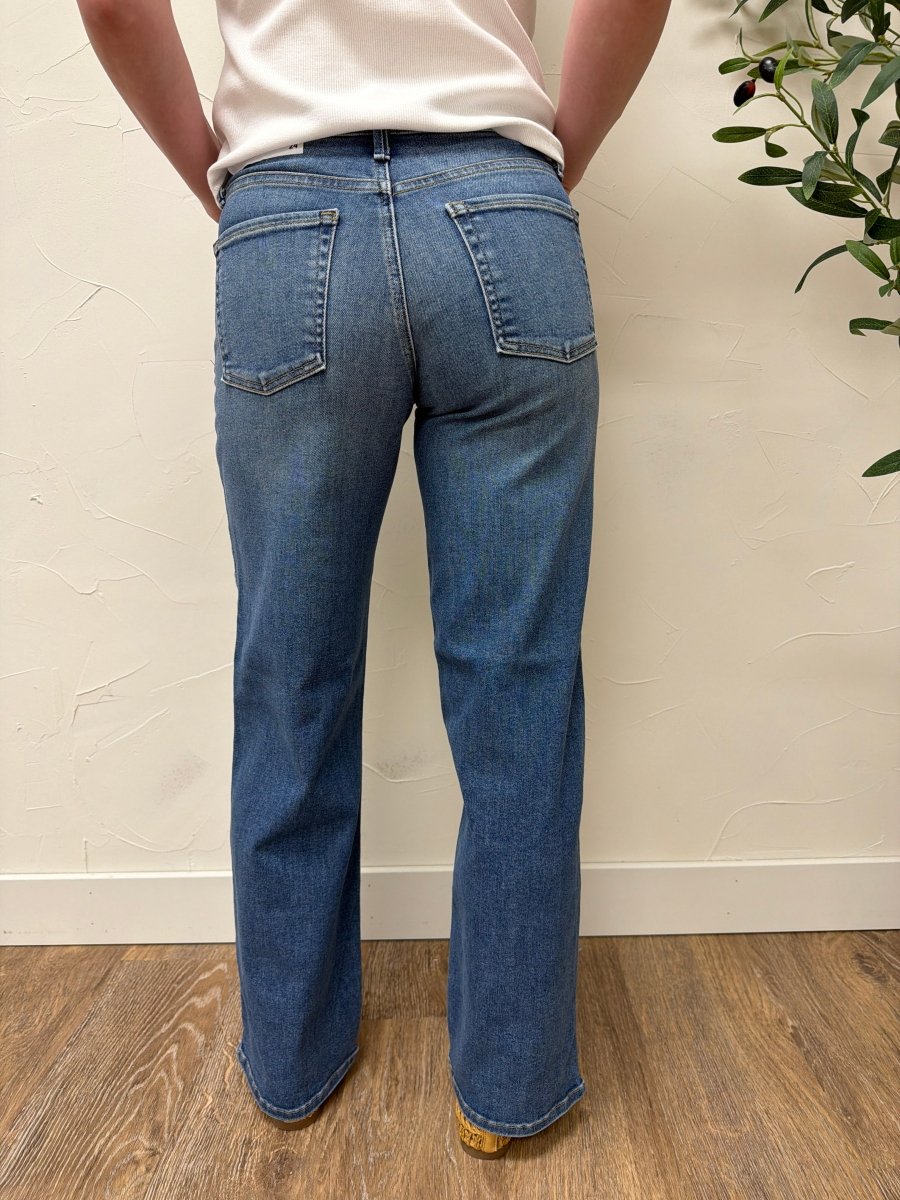 Back view of model wearing Loose Straight Fit Jeans showing clean design and regular hem — Three:Twelve Boutique