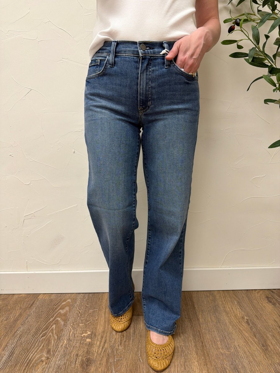 Lifestyle shot of model styled casually wearing Loose Straight Fit Jeans with a simple top — Three:Twelve Boutique