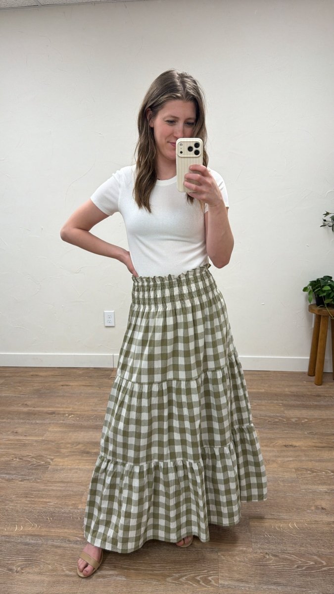 Lifestyle shot of model wearing willow check maxi skirt styled with casual outfit — Three:Twelve Boutique