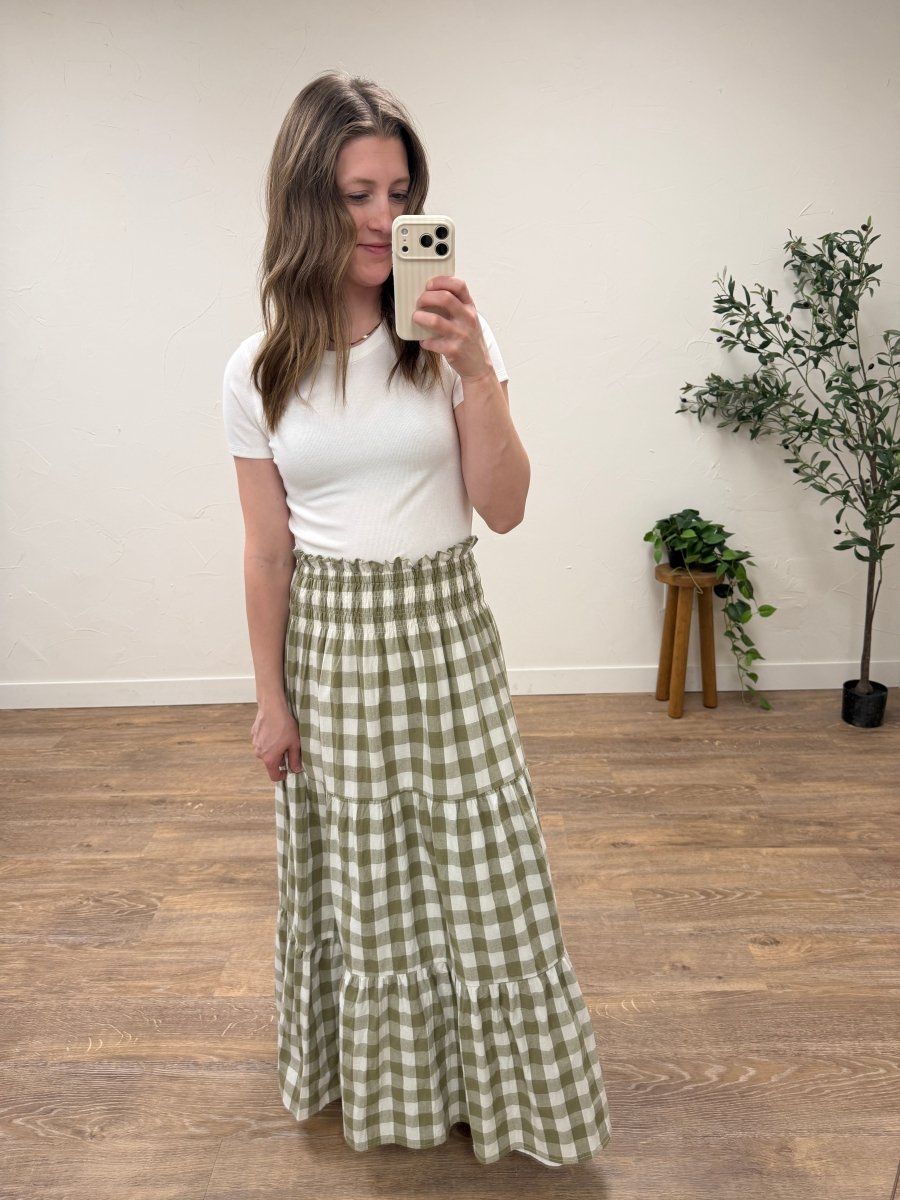 Lifestyle shot of model wearing willow check maxi skirt styled with casual outfit — Three:Twelve Boutique