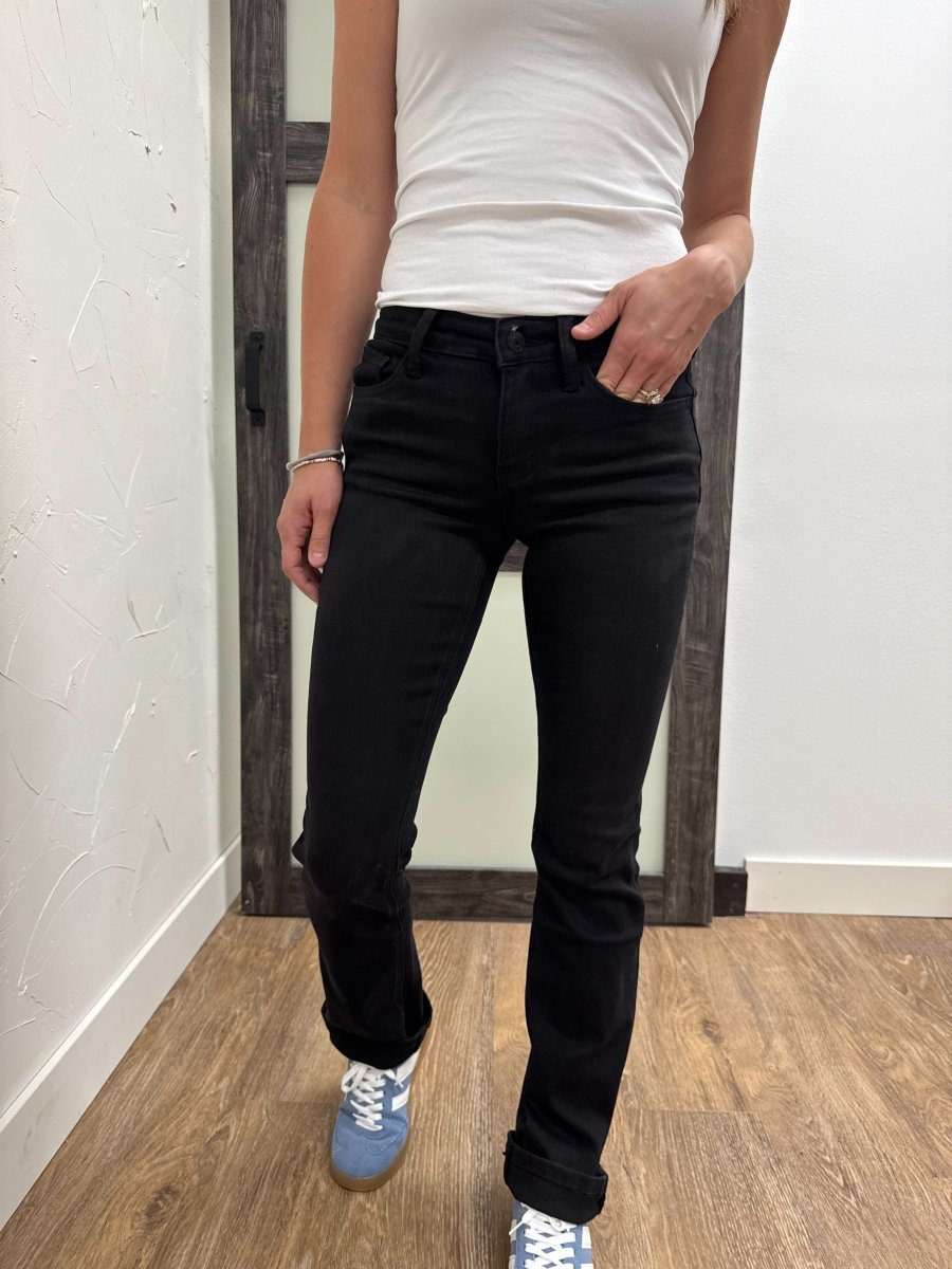 Front view of model wearing mid rise bootcut Vervet denim jeans — Three:Twelve Boutique