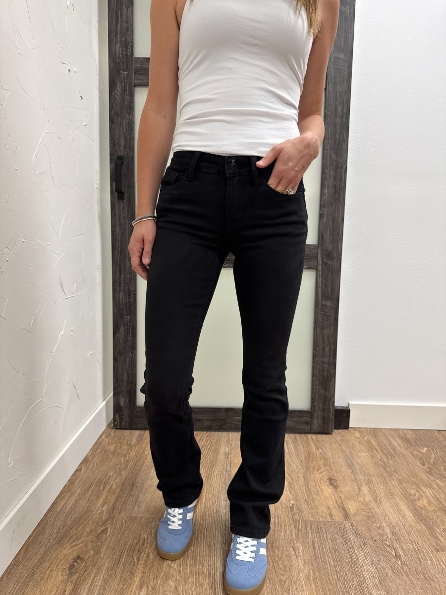 Front view of model wearing mid rise bootcut Vervet denim jeans — Three:Twelve Boutique