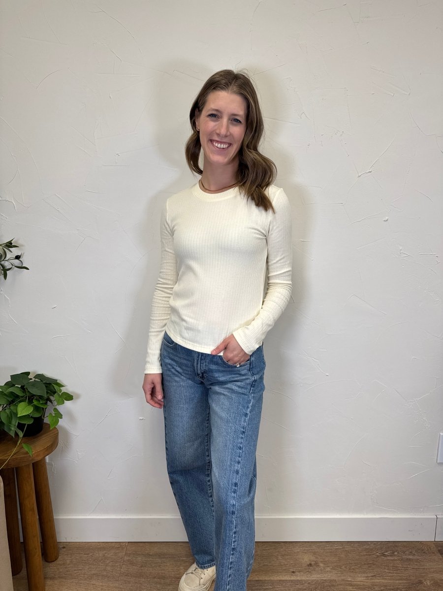 Lifestyle shot of Minnie long sleeve styled with denim — Three:Twelve Boutique