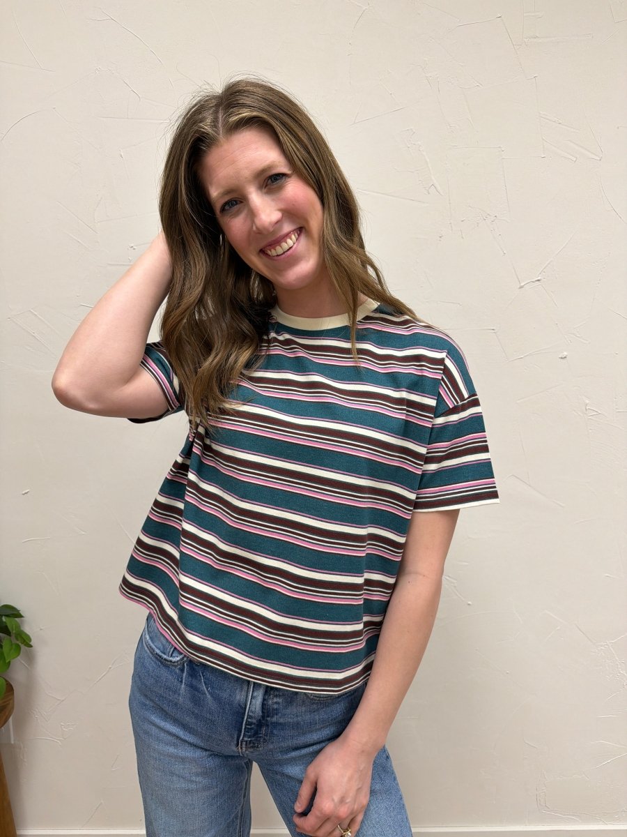 Lifestyle shot of model wearing striped tee styled with casual denim outfit — Three:Twelve Boutique