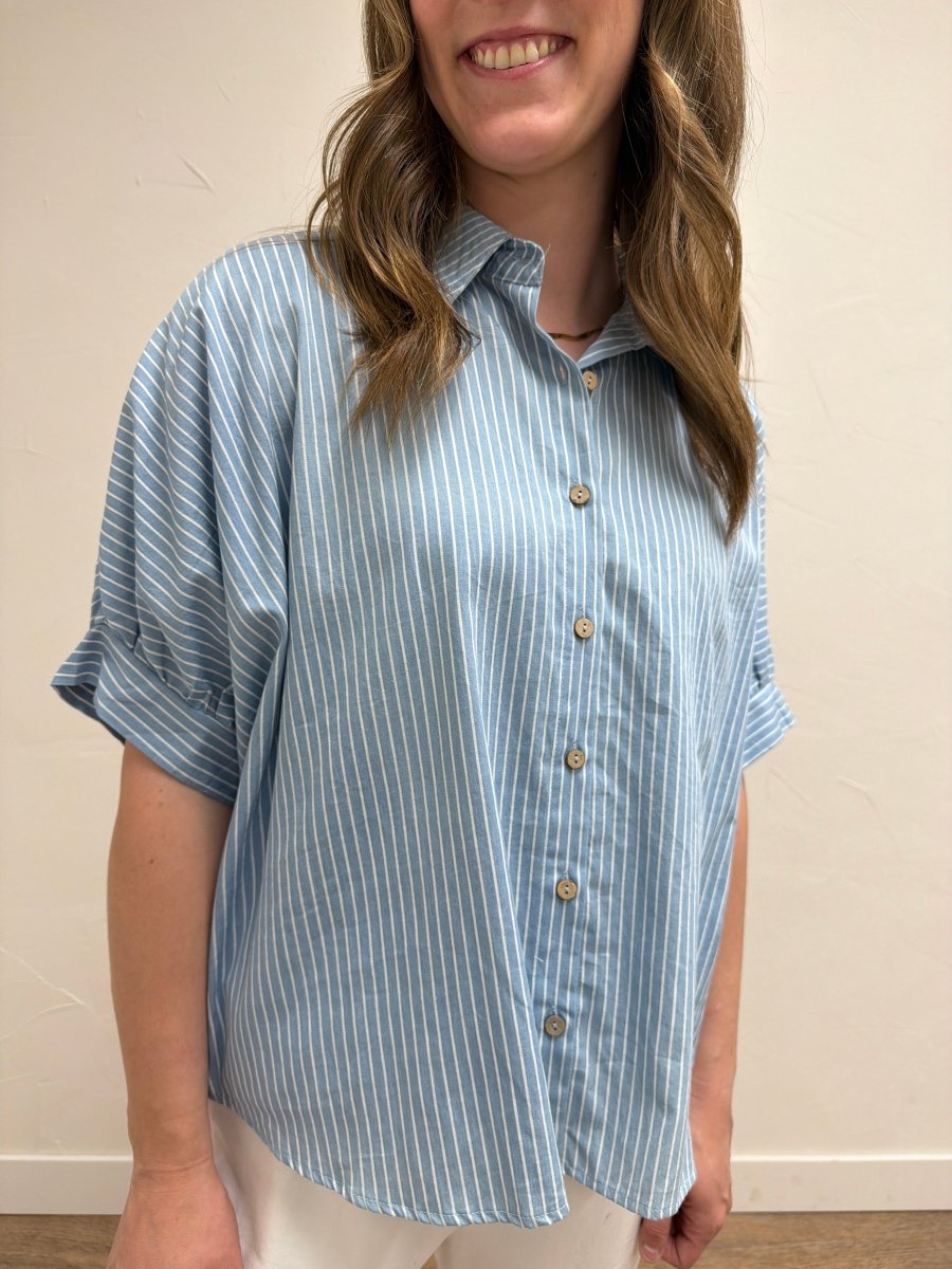 Close-up front view of model wearing Pinstripe Denim Button Down Top showcasing pinstripe detailing and button-front closure