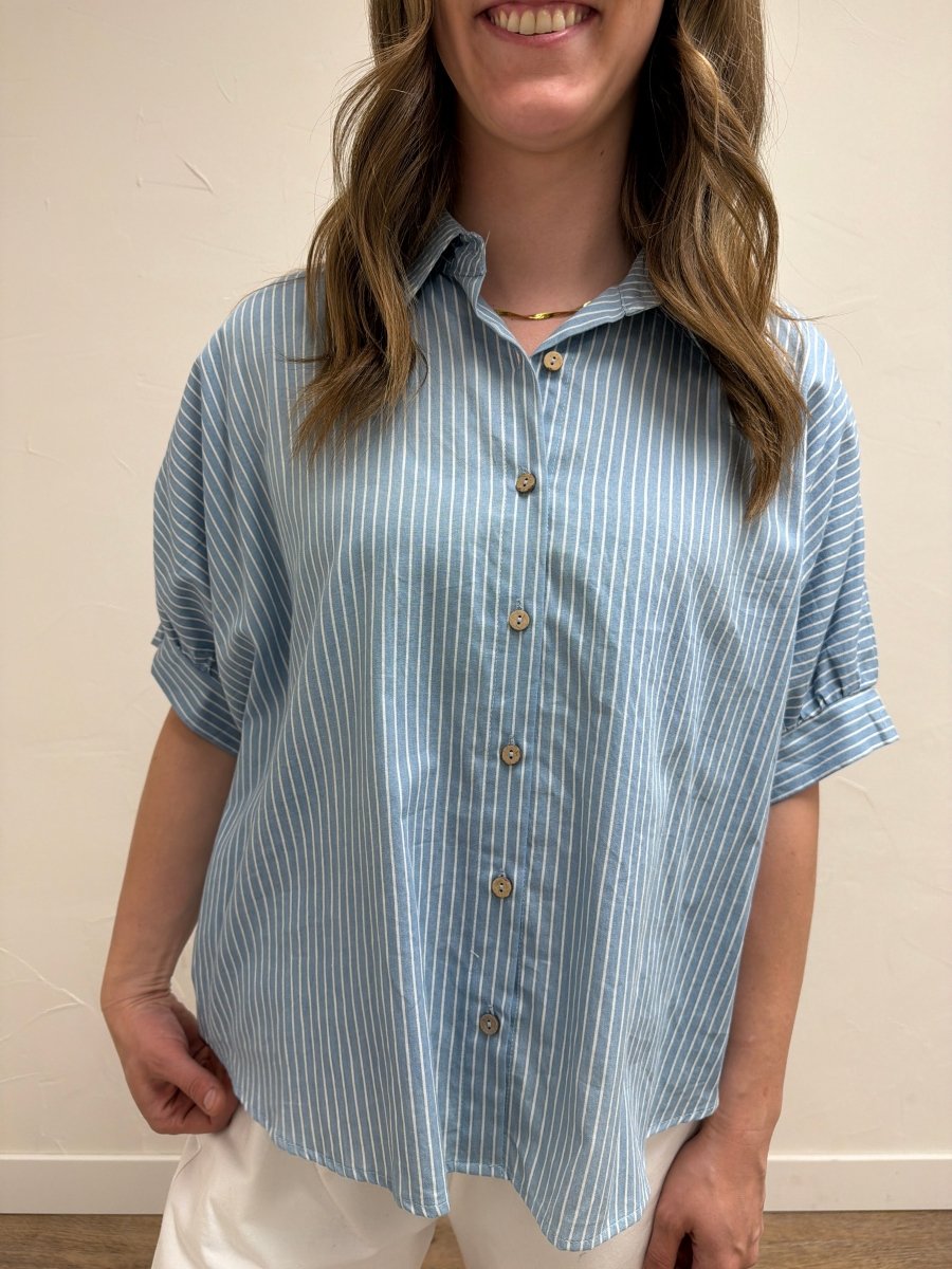 Close-up front view of model wearing Pinstripe Denim Button Down Top showcasing pinstripe detailing and button-front closure