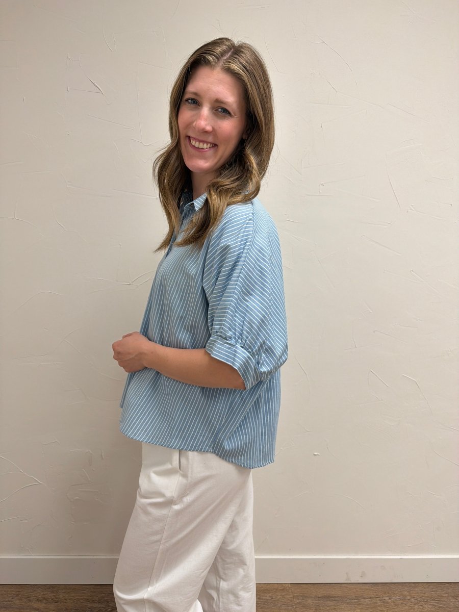 Side view of model wearing Pinstripe Denim Button Down Top for Women