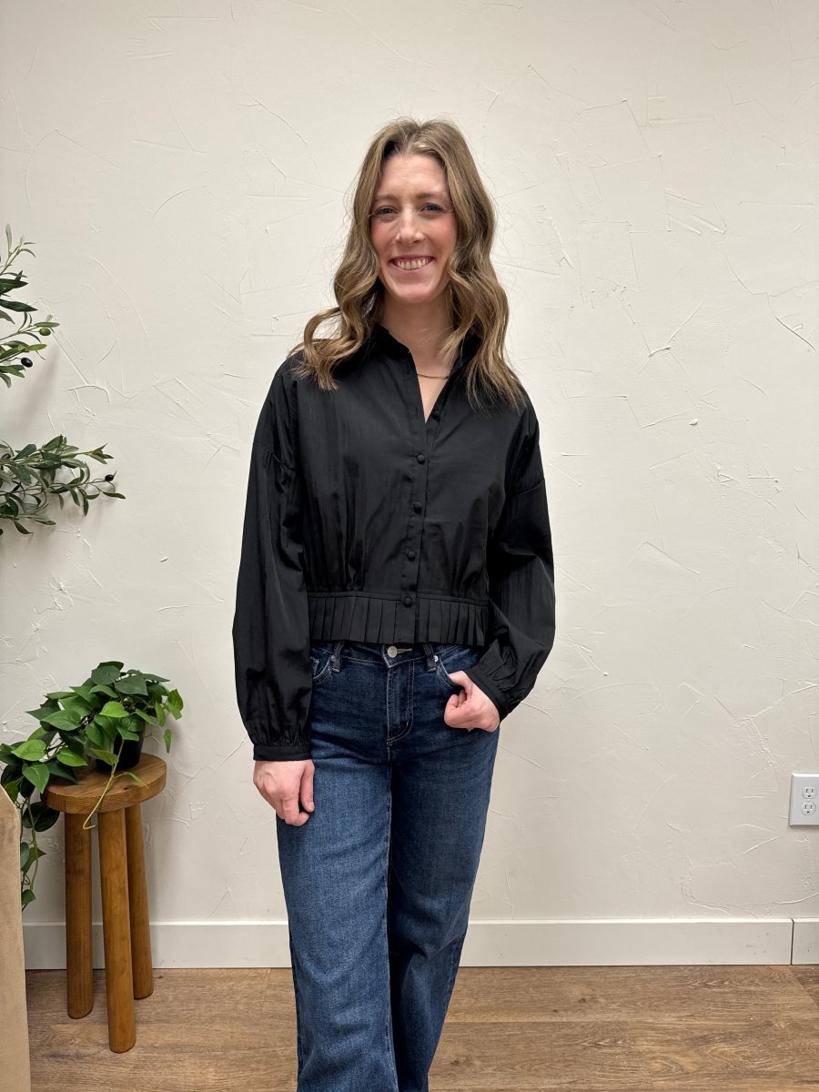 Lifestyle shot of model wearing raglan shirt styled casually with denim — Three:Twelve Boutique