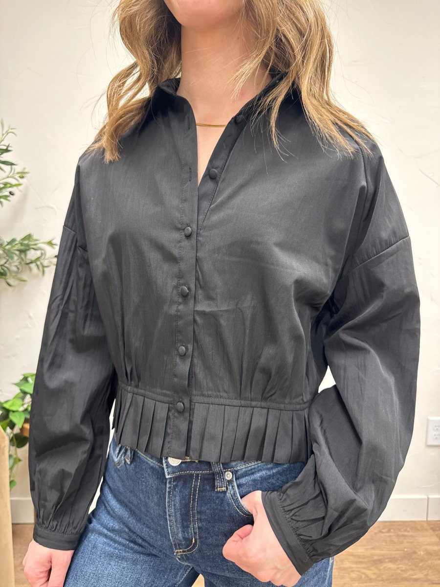 Front view of model wearing pleated hem raglan shirt showing relaxed fit — Three:Twelve Boutique