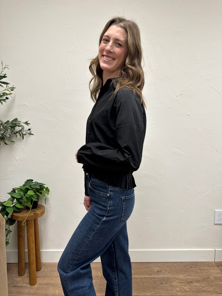 Side view of pleated hem raglan shirt showing drape and movement — Three:Twelve Boutique
