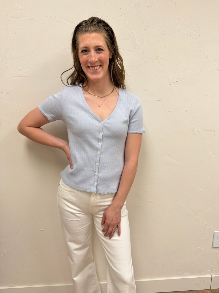 Lifestyle image of model wearing Pointelle V Neck Top styled with casual denim — Three Boutique