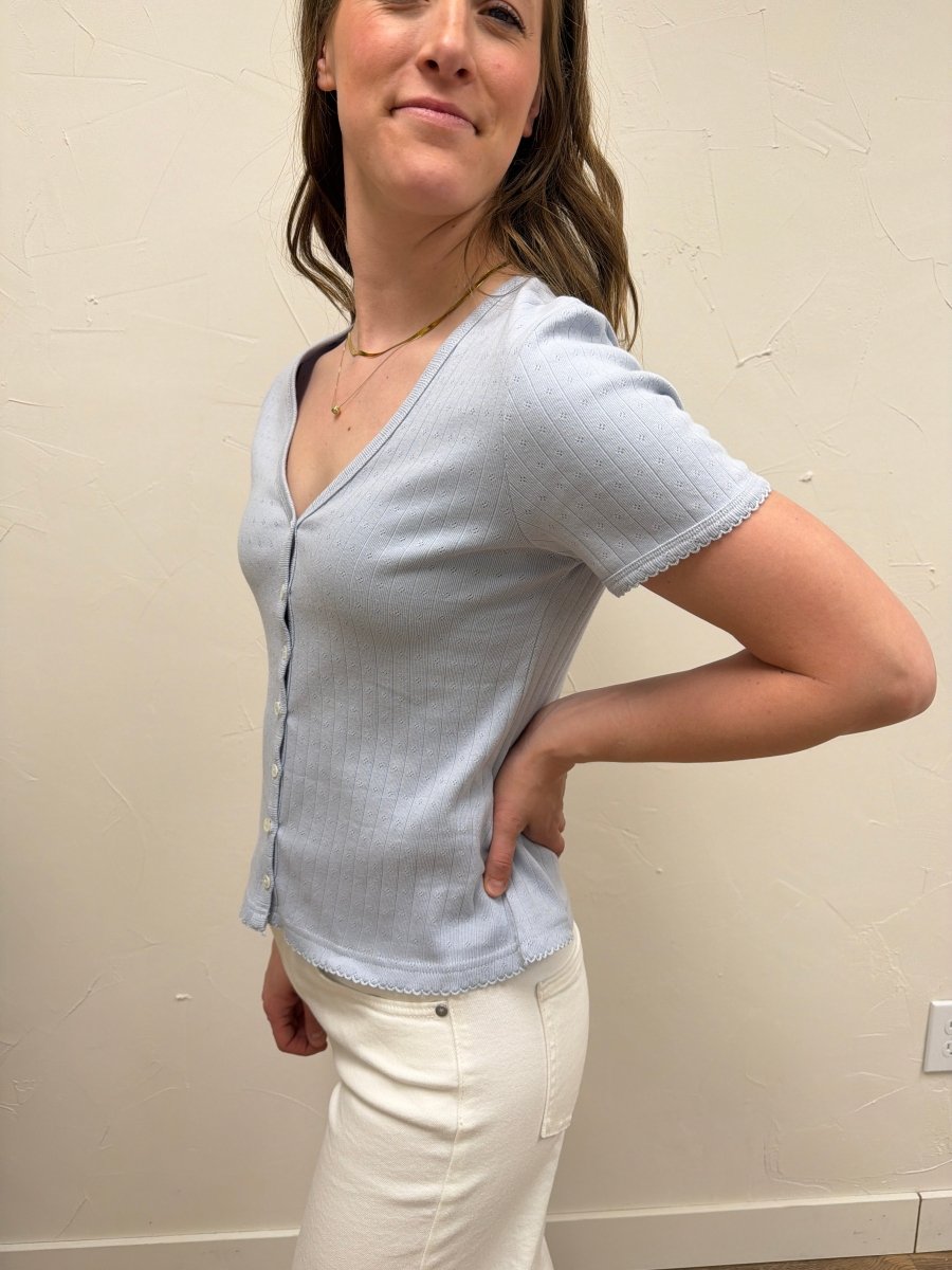 Side view of Pointelle V Neck Top highlighting V neckline and fit — Three Boutique